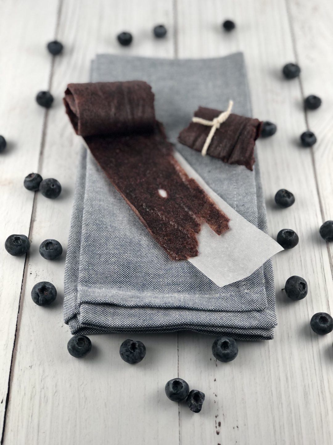 Mixed Berry Fruit Leathers on a parchment lined sheet.