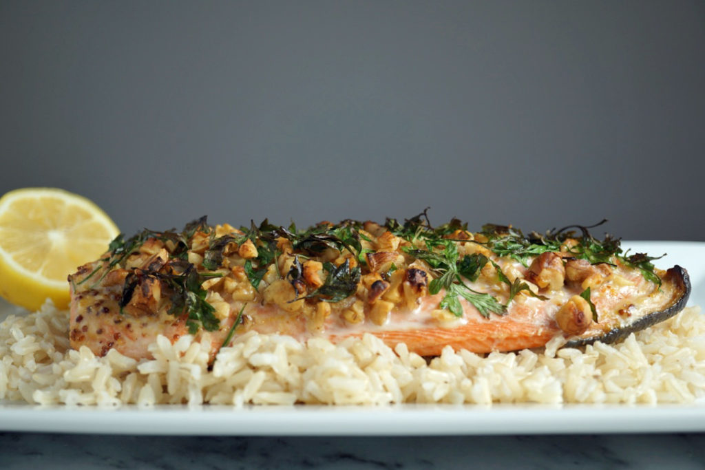 low FODMAP foods - pecan crusted salmon on top of brown rice