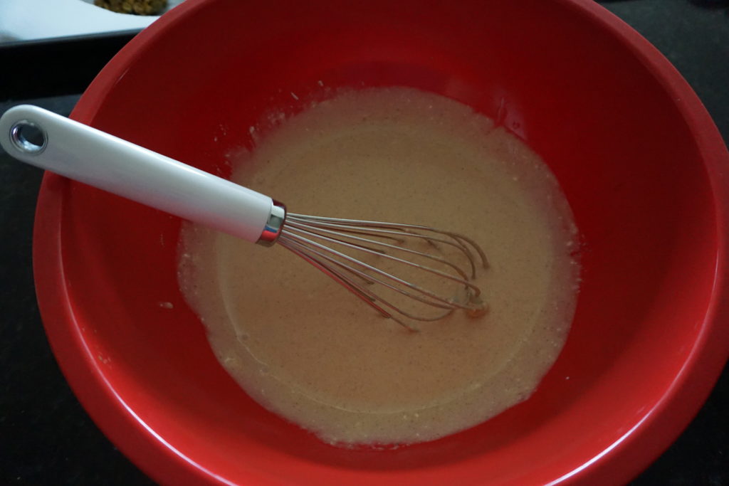 Whisking pumpkin icecream ingredients.