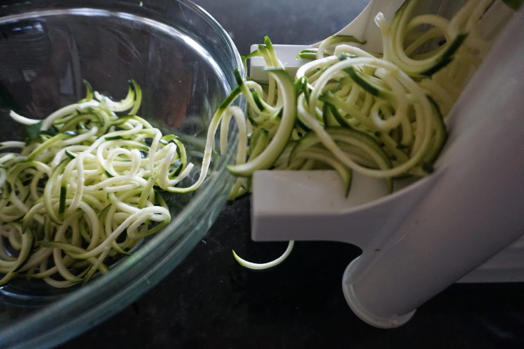 Zucchini being transformed into zoodles