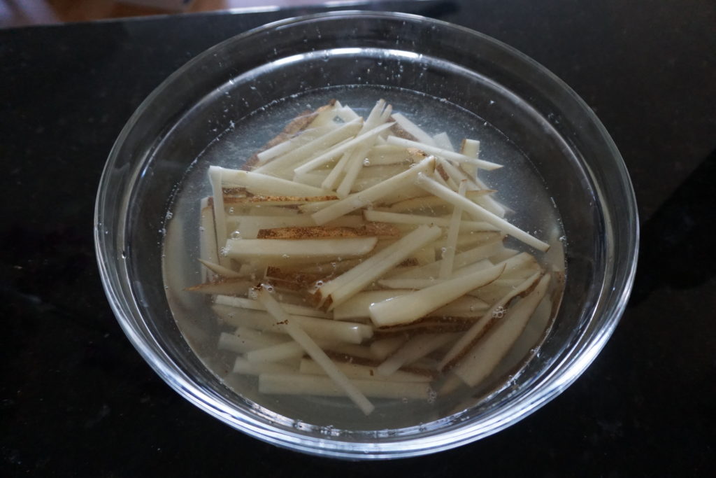 Potatoes Cut and Soaked in Water.