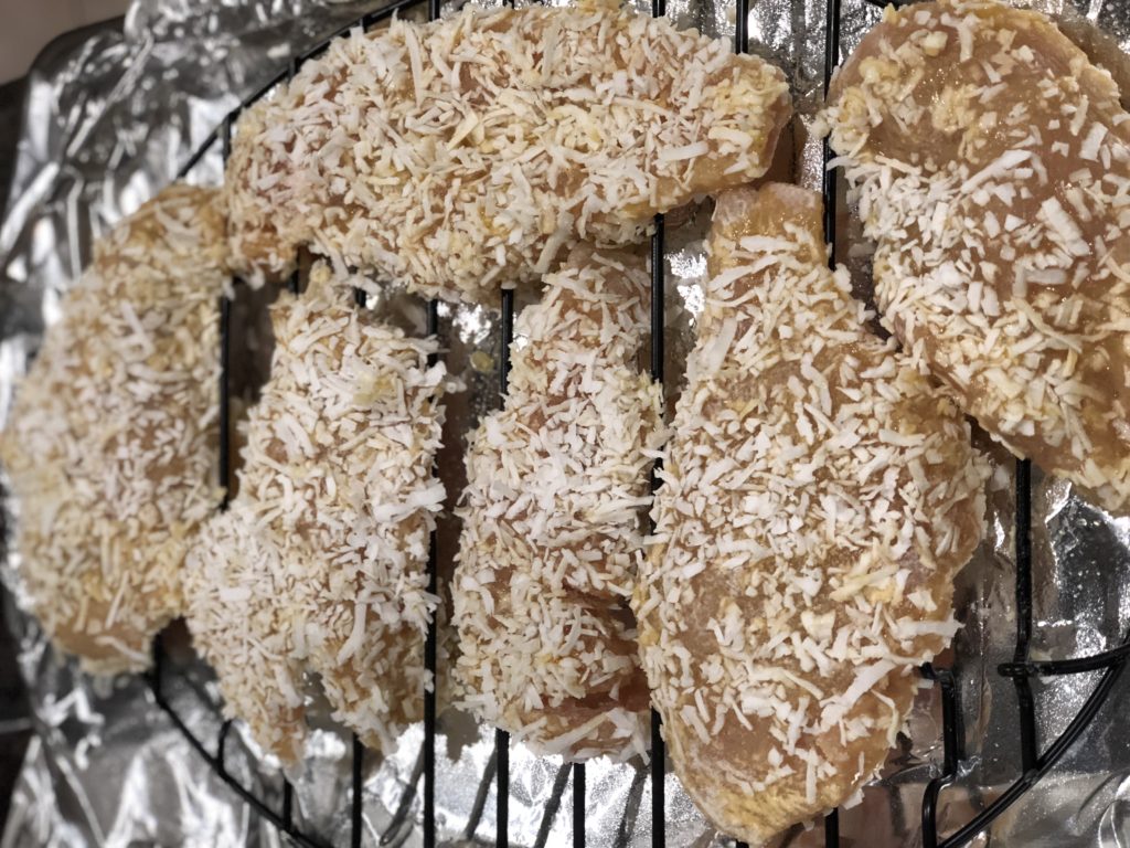 Coconut coated chicken ready to be baked