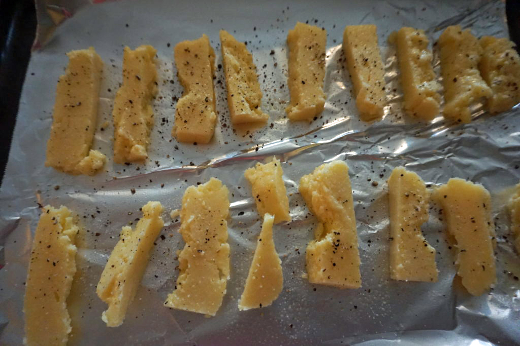 Low FODMAP polenta fries ready to be baked.