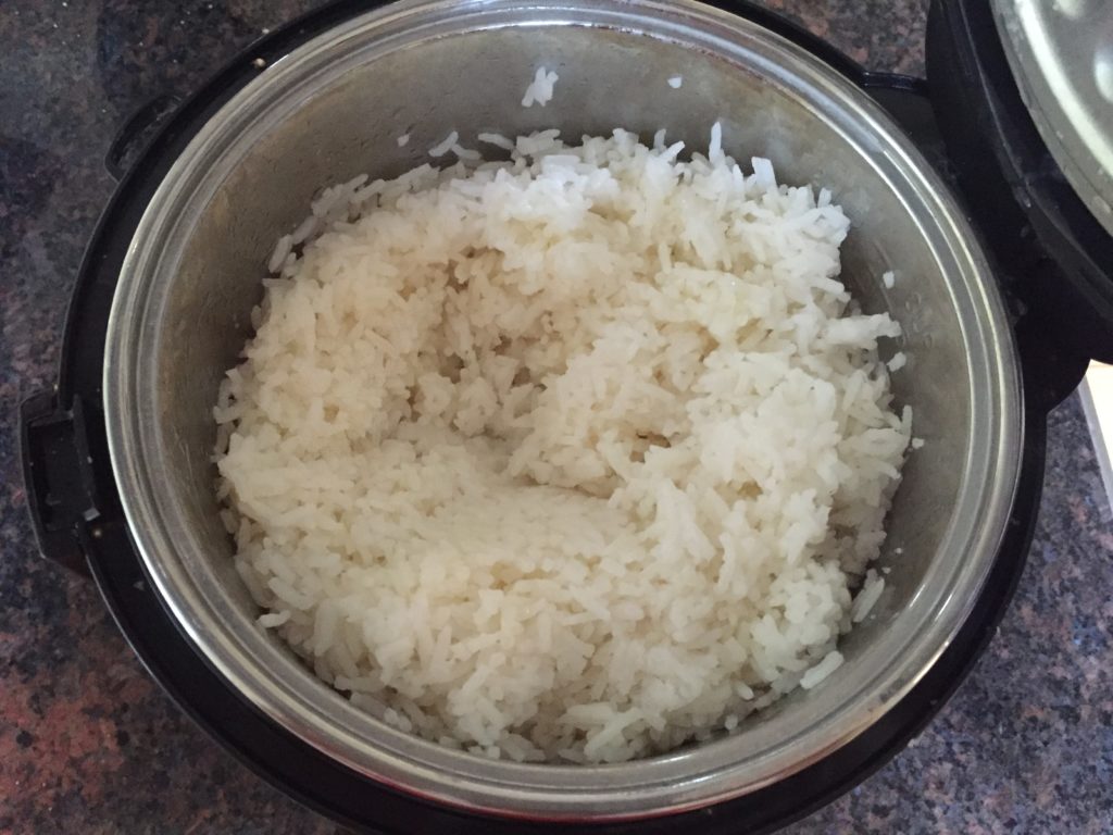 Rice Being Cooked in Rice Cooker - perfect side dish for a low FODMAP dinner.