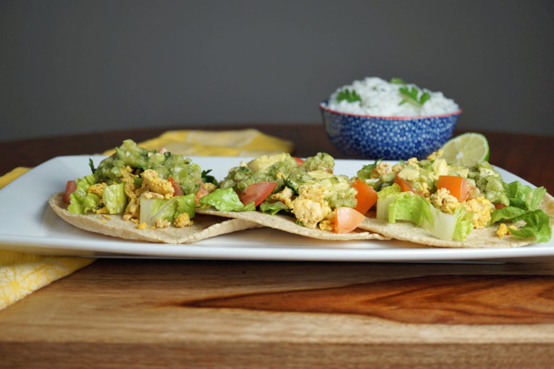 FODMAP safe dinner - Ground Turkey Tacos on a white plate with a bowl of rice