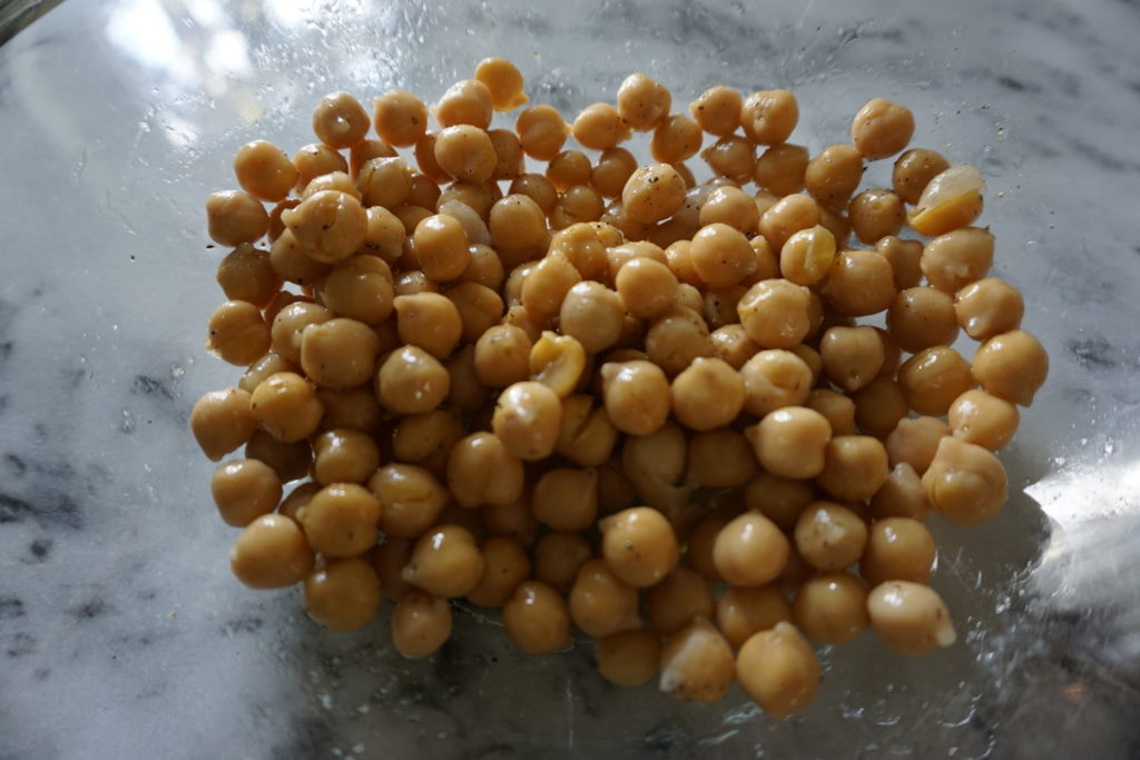 FODMAP snack in the making - chickpeas in a glass bowl.