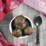 Peanut Butter Chocolate Banana Ice Cream in a white bowl surrounded by a pink napkin. FODMAP desserts