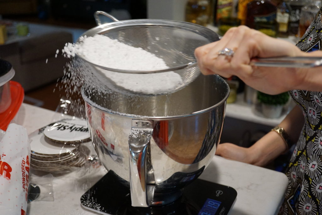 Sifting the powdered sugar.