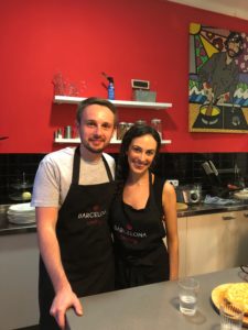 My husband and I taking a cooking class in Barcelona