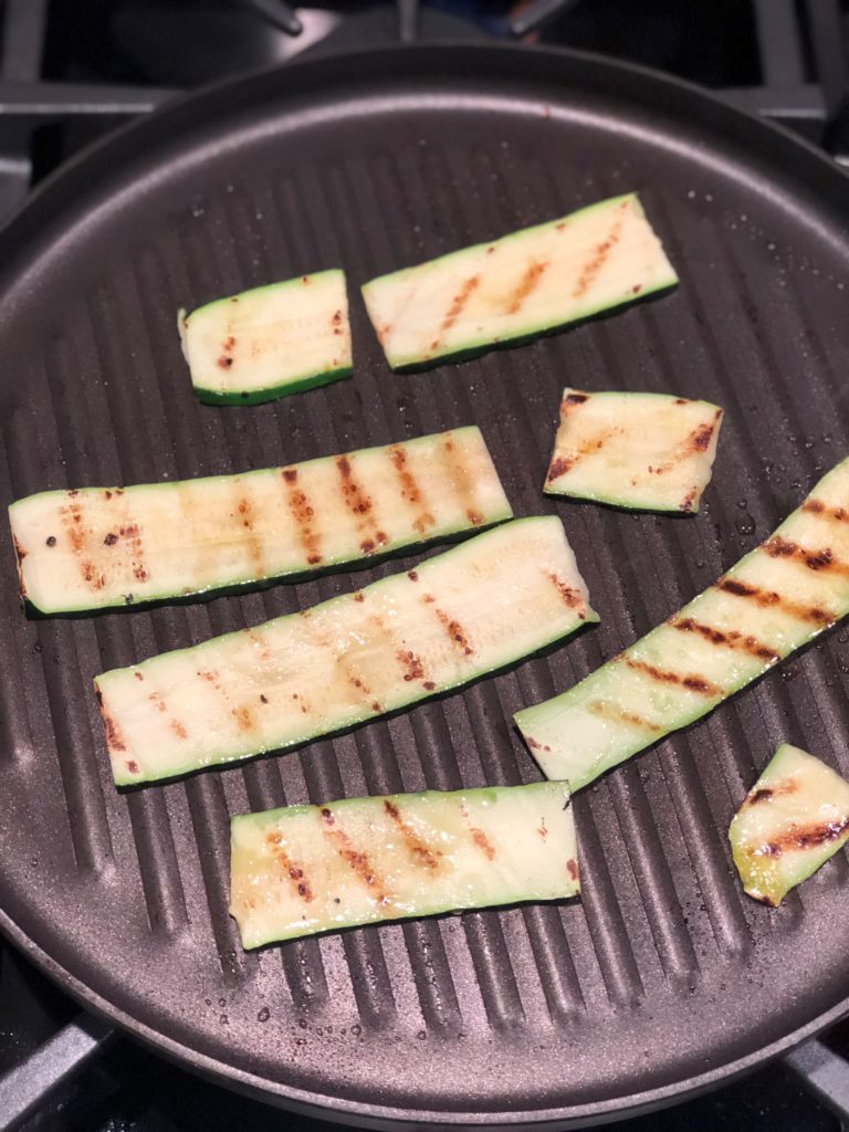 Sliced Zucchini on a grill pan.