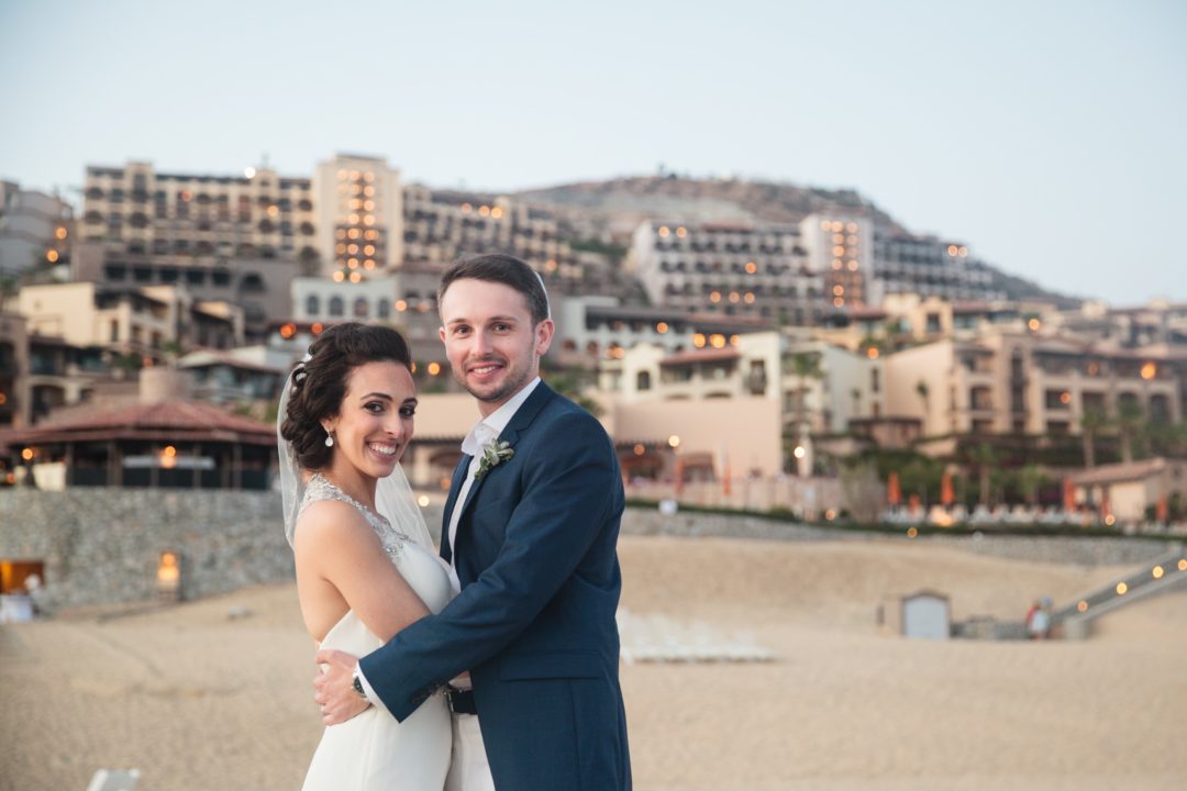 My husband and I on the beach in Cabo. Article has tips and tricks during wedding season on the FODMAP diet.