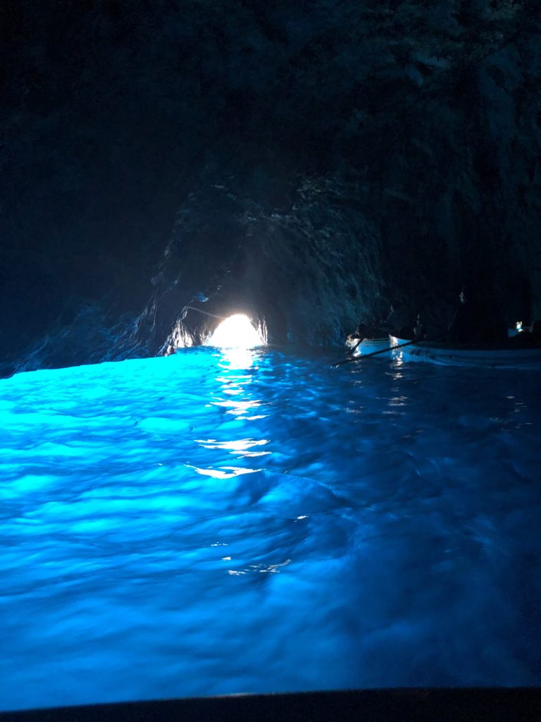 The Blue grotto - amazing blue water inside the grotto in Capri, Italy.