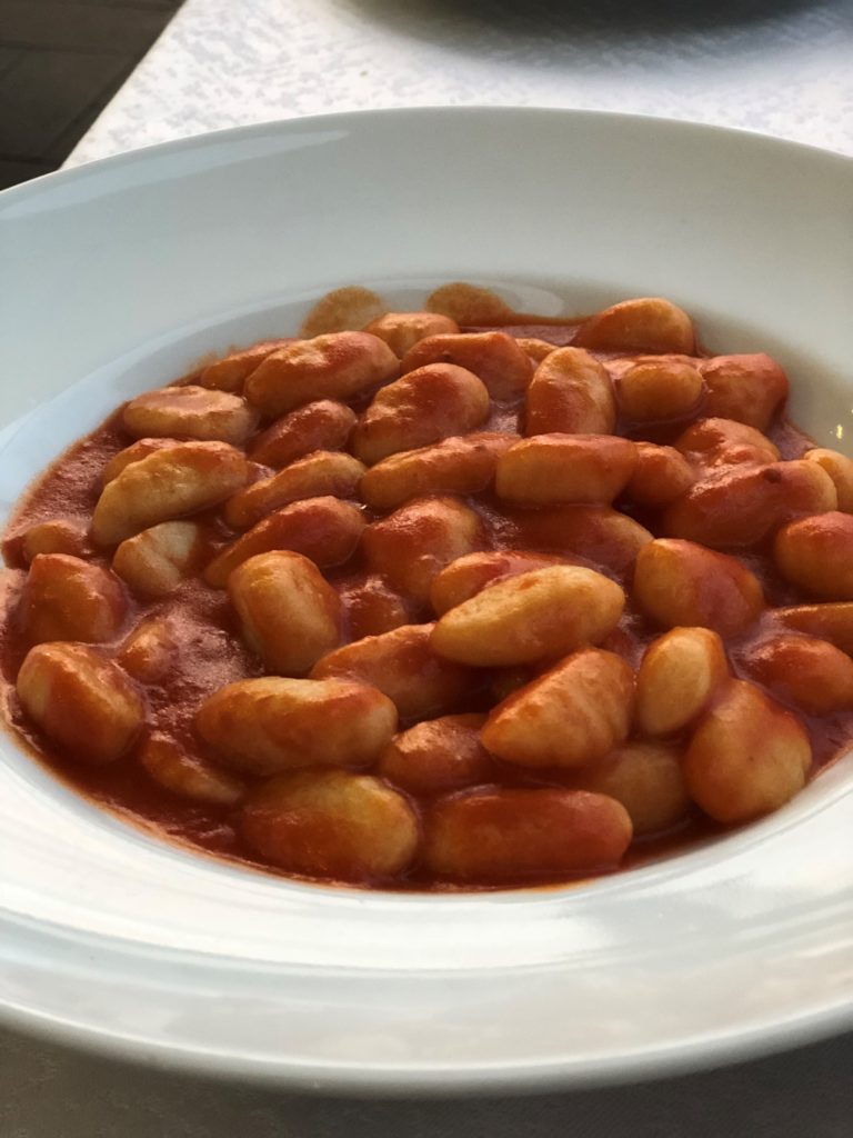 Gluten-free gnocchi with a garlic-free pasta sauce in Sorrento, Italy.