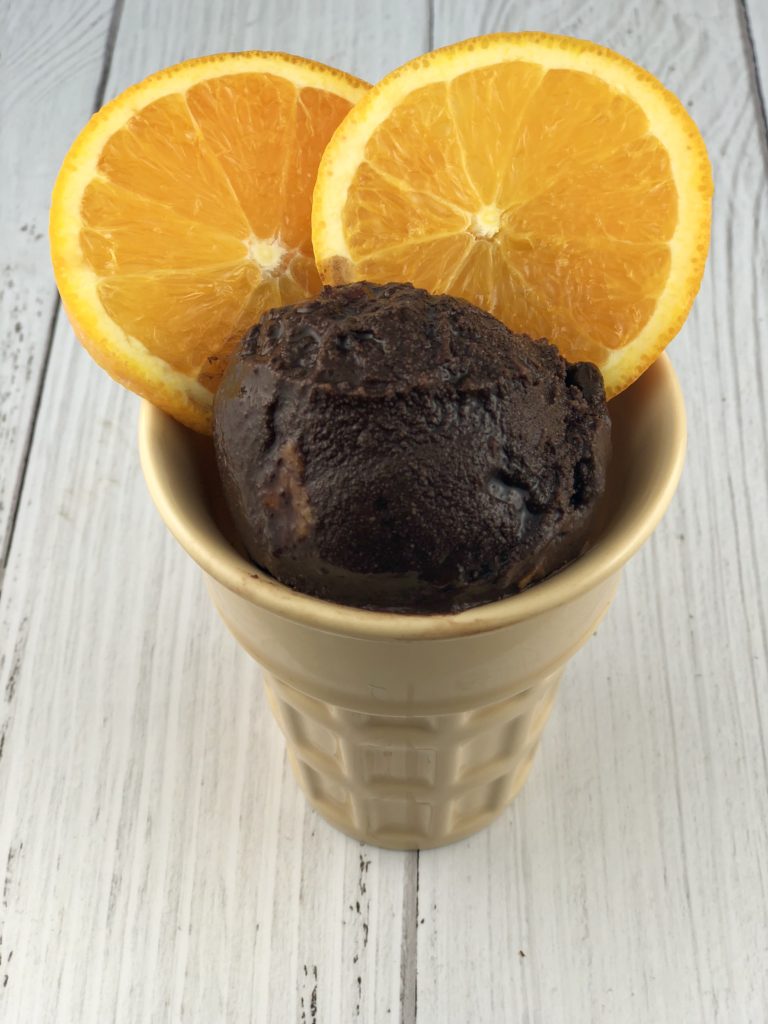 FODMAP desserts - dark chocolate sorbet with candied oranges in a porcelain cone