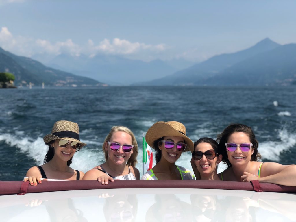 Girlfriends on a boat tour in Lake Como, Italy.