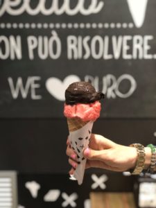 Dark chocolate and strawberry gelato in a gluten-free cone in Sorrento, Italy