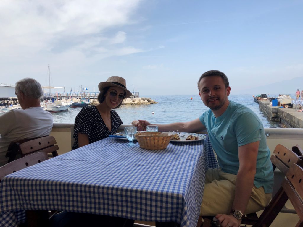 Eugene and I sitting outside of a restaurant in Sorrento, Italy.